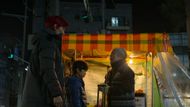 Gi-hun hands over Cheol to Sang-woo’s mother. (Image Via. Netflix)